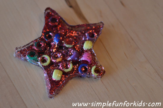 Glue star suncatchers with beads and glitter - a simple, fun craft for toddlers, preschoolers and up.