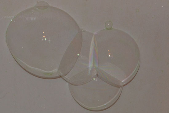 Blow soap bubbles on water - they'll stick around for a long time, look interesting, and be lots of fun to sit in and/or pop!