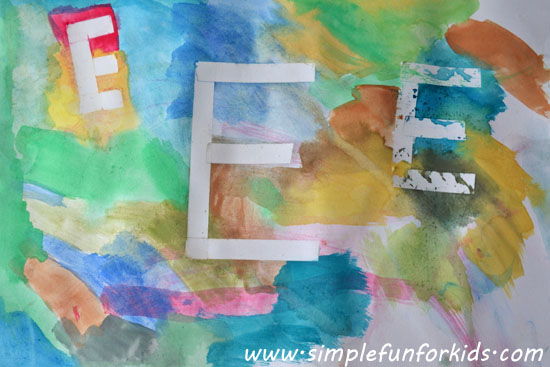Make sticky tape resist initials by painting with watercolors over sticky tape!