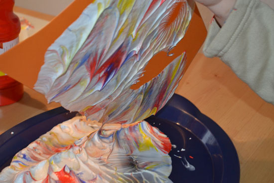 Use the shaving cream marbling technique to make marbled eggs with your child to decorate for Easter!