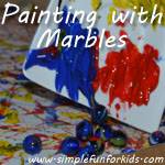 Painting with marbles - an art idea for toddlers and up that's a bit messy but great fun, and the results are lovely!