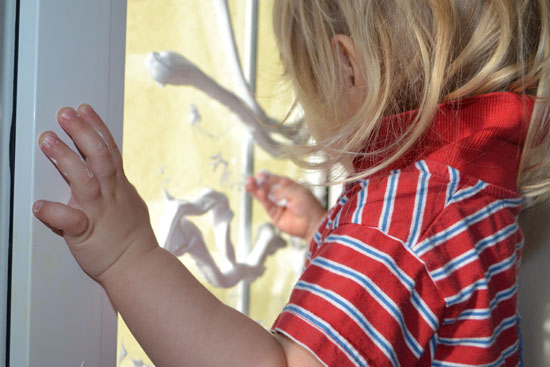 Play with shaving cream on the window. A sensory activity that doubles as writing/pre-writing practice!