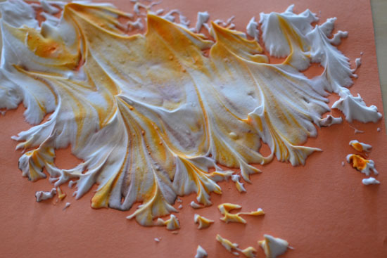Use shaving cream and liquid watercolors to make Marbled Pumpkins and decorate for fall!