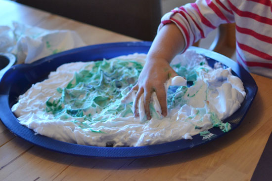 Make quick and simple marbled Christmas trees with colorful decorations using the shaving cream marbling technique!