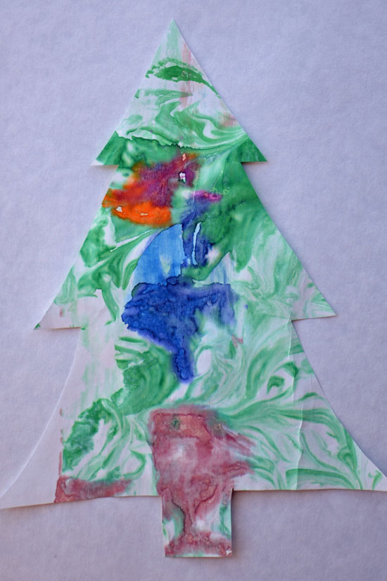 Make quick and simple marbled Christmas trees with colorful decorations using the shaving cream marbling technique!