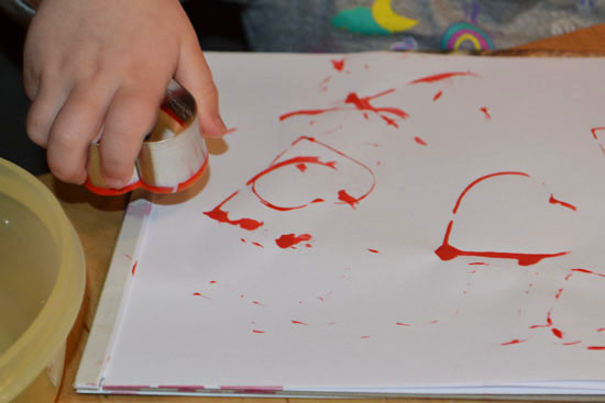 An easy technique for your toddler to make heart-shaped imprints!