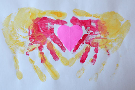 Make a super sweet Double Handprint Heart with your toddler for Valentine's Day!