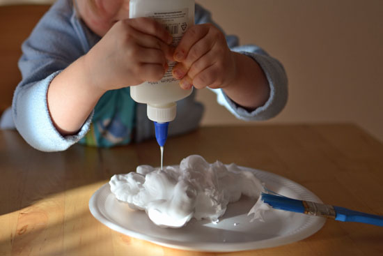 Use shaving cream puffy paint to make simple puffy snowmen decorations!