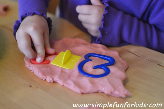 Combine basic math concepts with sensory play while exploring numbers with play dough.
