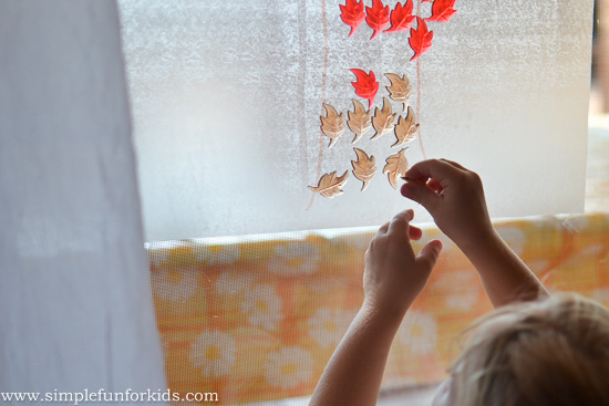 Play a quick and easy Contact Paper Fall Tree Counting Game with your preschooler with simple materials!
