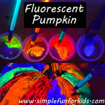 Pumpkin decoration: Make a fluorescent pumpkin with the black light on while painting - it looks SO COOL!