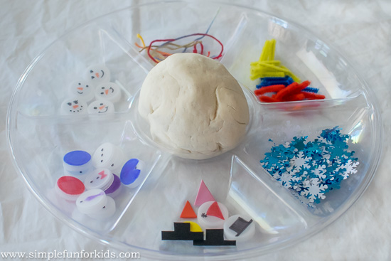 Winter Activities for Kids: Build a bottle cap snowman in play dough!