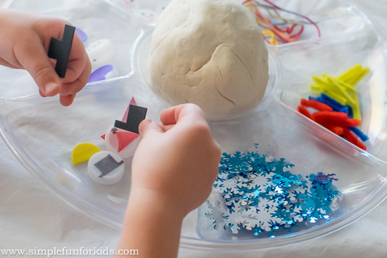Winter Activities for Kids: Build a bottle cap snowman in play dough!