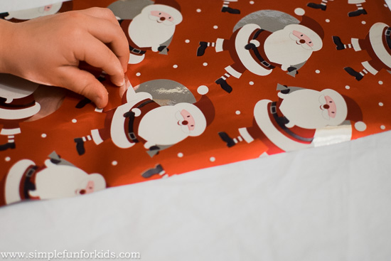 Make a simple DIY wrapping paper puzzle for a quick, easy and fun way to practice fine motor and problem solving skills, and to recycle old wrapping paper!