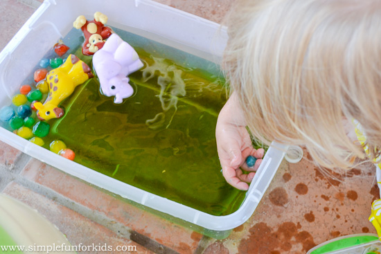 Simple sensory play for kids with colored ice and water in the water table!