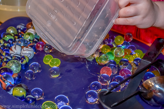 Sensory Play with Water Beads and Marbles: Exploring hard and soft and practicing fine motor skills!