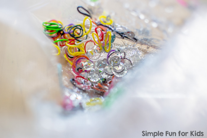 Simple Baby Safe Sensory Activity with Non-Baby Safe Items: Sensory Bag with Loom Bands, Glitter, and Sequins!