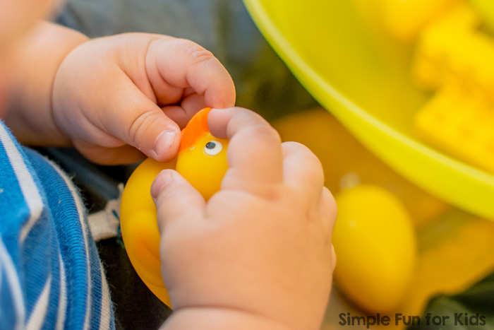 Simple yellow sensory bin with items you have around the house as an introduction to colors for babies and toddlers!