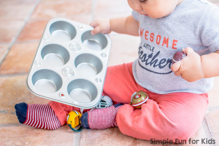 Sensory Activities for Kids: Quick and simple toddler play with mini football helmets in a muffin tin!