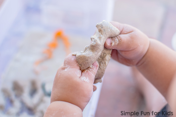 Simple messy sensory play with Halloween quick sand for toddlers!