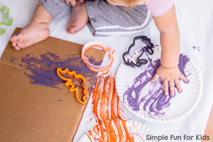 Super fun Halloween Cookie Cutter Art for toddlers, using simple and colorful homemade, taste-safe paint!