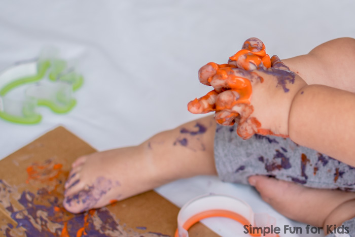 Super fun Halloween Cookie Cutter Art for toddlers, using simple and colorful homemade, taste-safe paint!