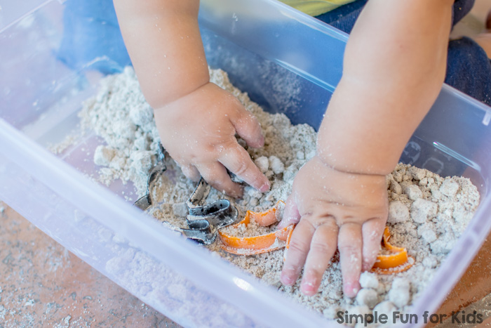 Sensory Activities for Kids: Sibling Play with Dried Out Halloween Quick Sand