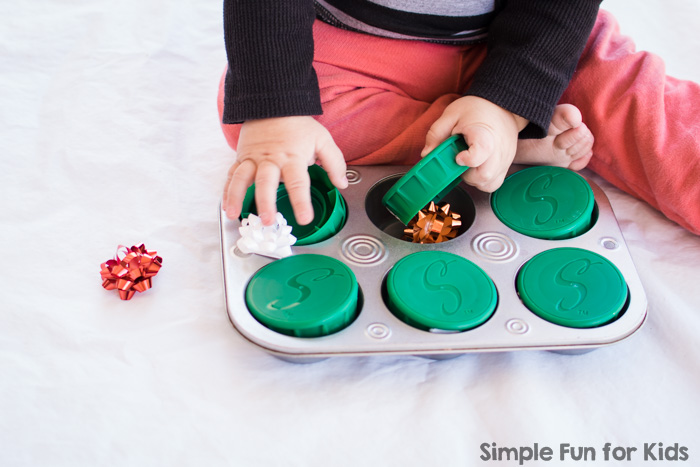 This time, my toddler found a Christmas surprise in a muffin tin! The set up was quick and simple, but it allowed for lots of fun sensory play and learning!