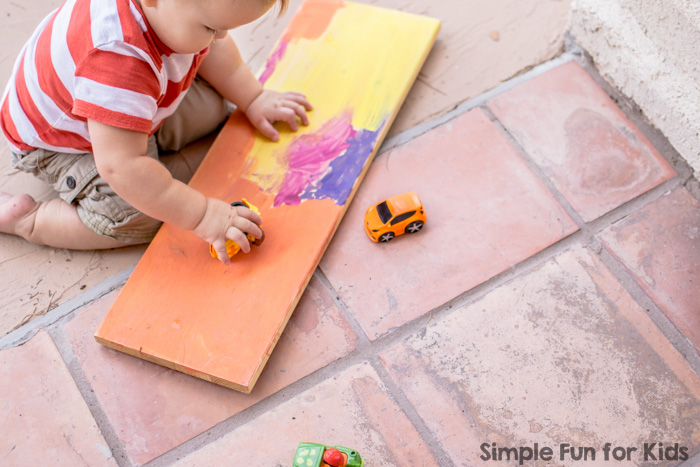 Try this super simple toddler science activity with your kids: First Toddler Play with a Ramp!