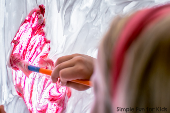 This was AWESOME! We'd wanted to try painting on shaving cream on a window for years, and when we finally did it, it was super fun! Art and sensory all rolled into one, and really easy to clean up, too!