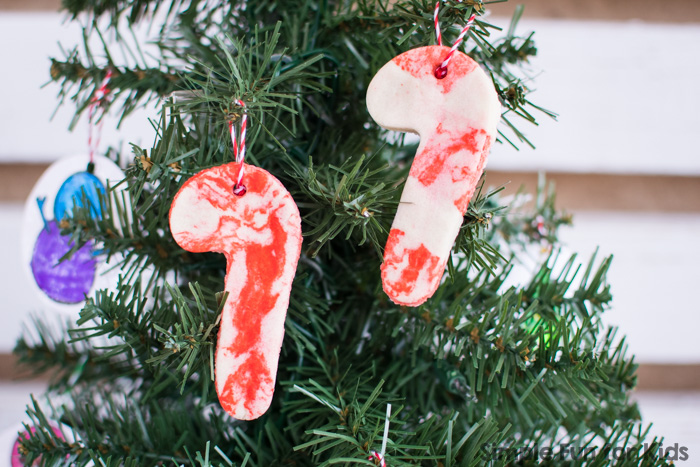 I hadn't used salt dough in decades, but now that we've tried it, I think we'll make a LOT of salt dough Christmas ornaments! Check out these simple salt dough candy cane ornaments from plain and colored salt dough!