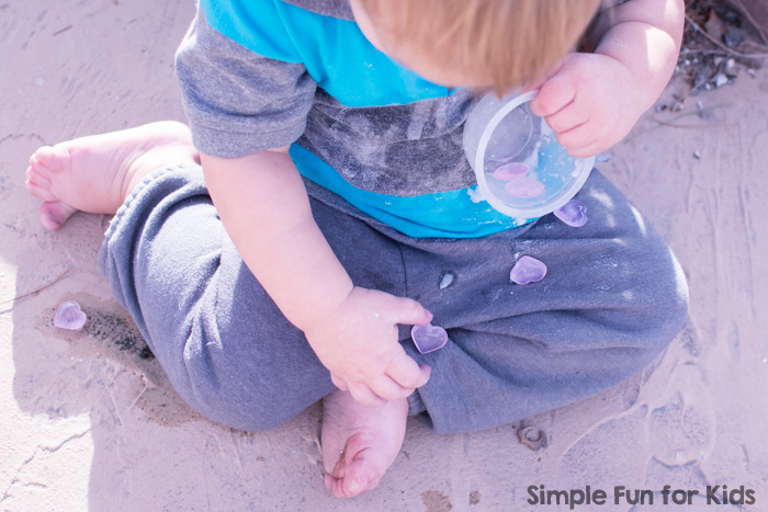 Super fun for toddlers and preschoolers on Valentine's Day or any day: Simple Baking Soda, Vinegar, and Hearts Sensory Play in the water table (or a sensory bin), perfect for siblings or play dates.
