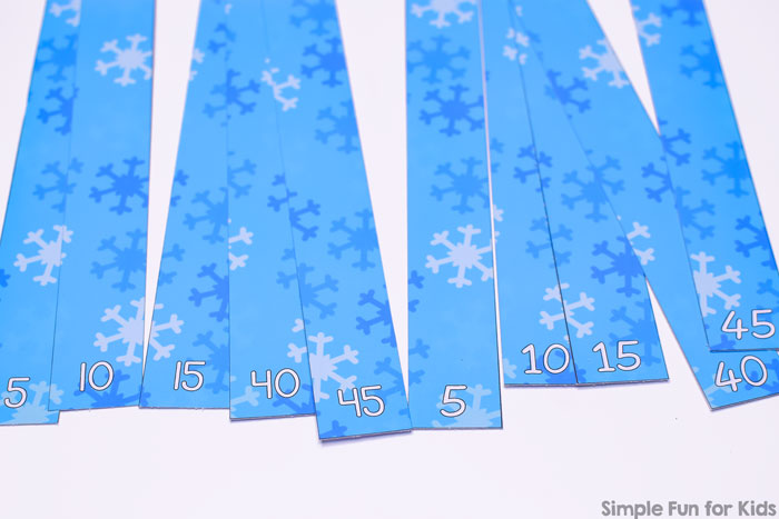 Practice skip counting and explore multiples of 5 with these cute printable Snowflakes Skip Counting by 5s Puzzle for kindergarteners and first graders.