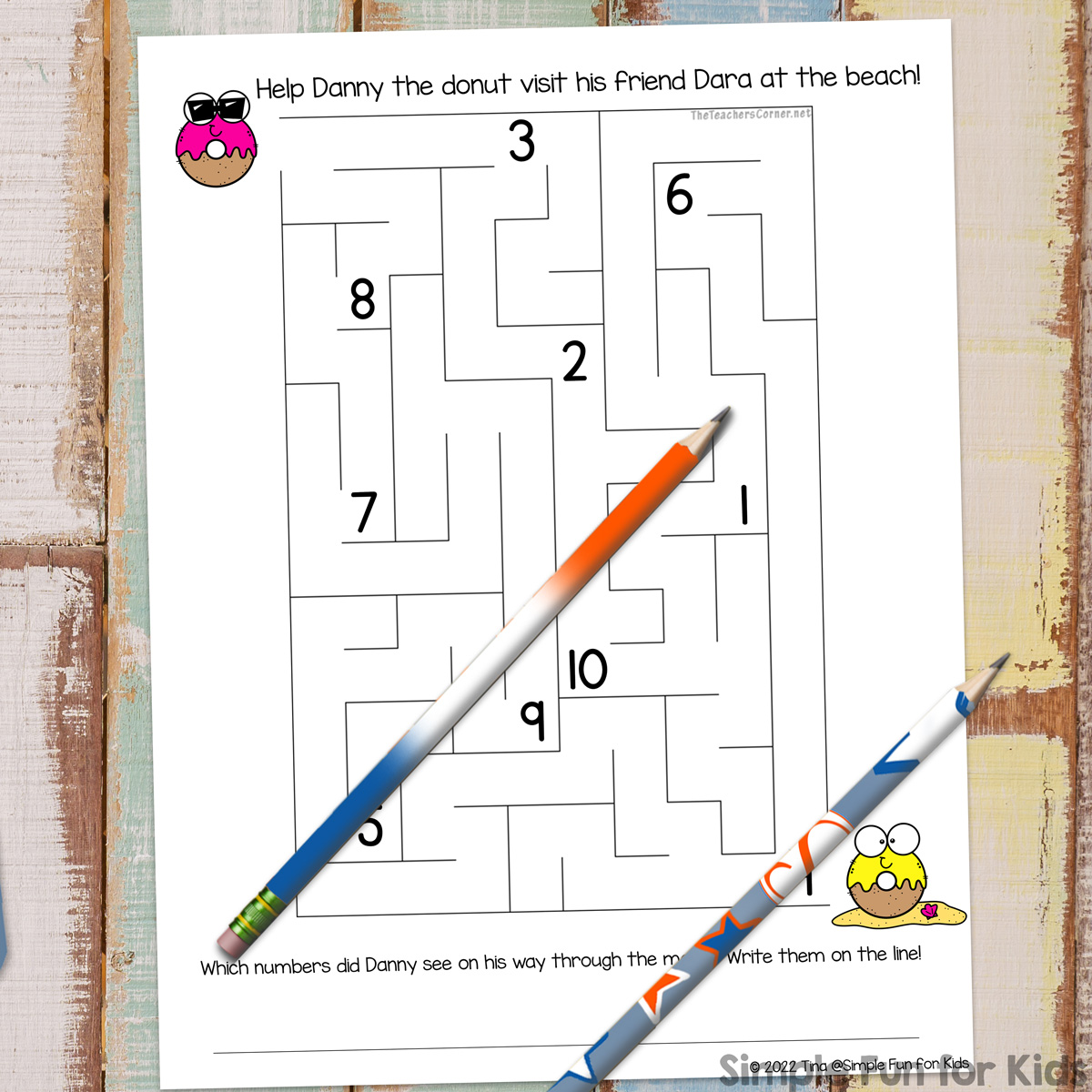 Summer Donuts Number Maze printable on top of a wooden desktop with two pencils. At bottom right, there's a Simple Fun for Kids watermark.