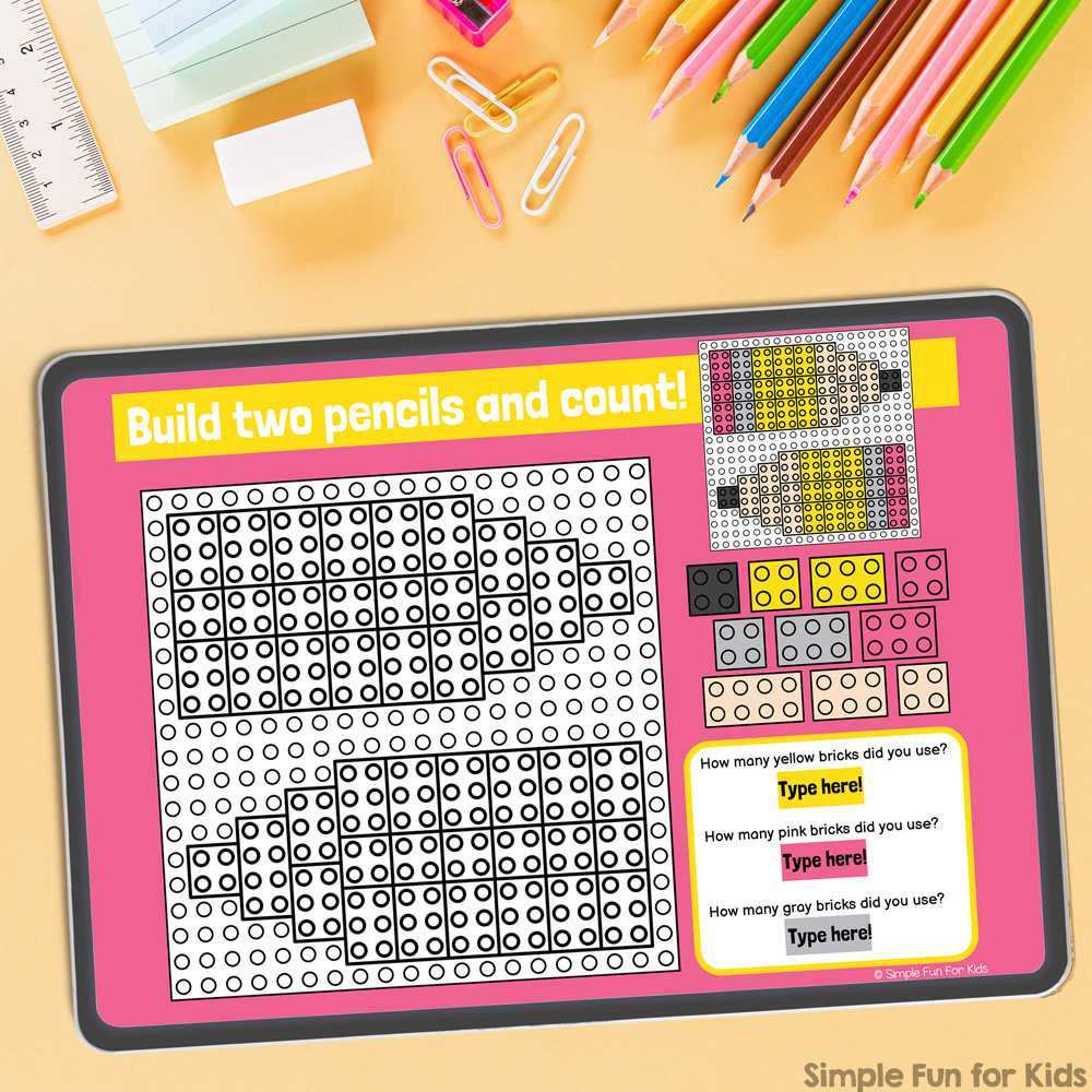 Picture of one slide taken from the Digital LEGO Back to School Build and Count Challenges and displayed on a gray tablet. 
The tablet is on top of a yellow desk with a ruler, paperclips, colored pencils, and other stationery items.
The objective of the challenge is to build two pencils from the digital building bricks on the right. Afterward, kids count how many bricks of each color were used.