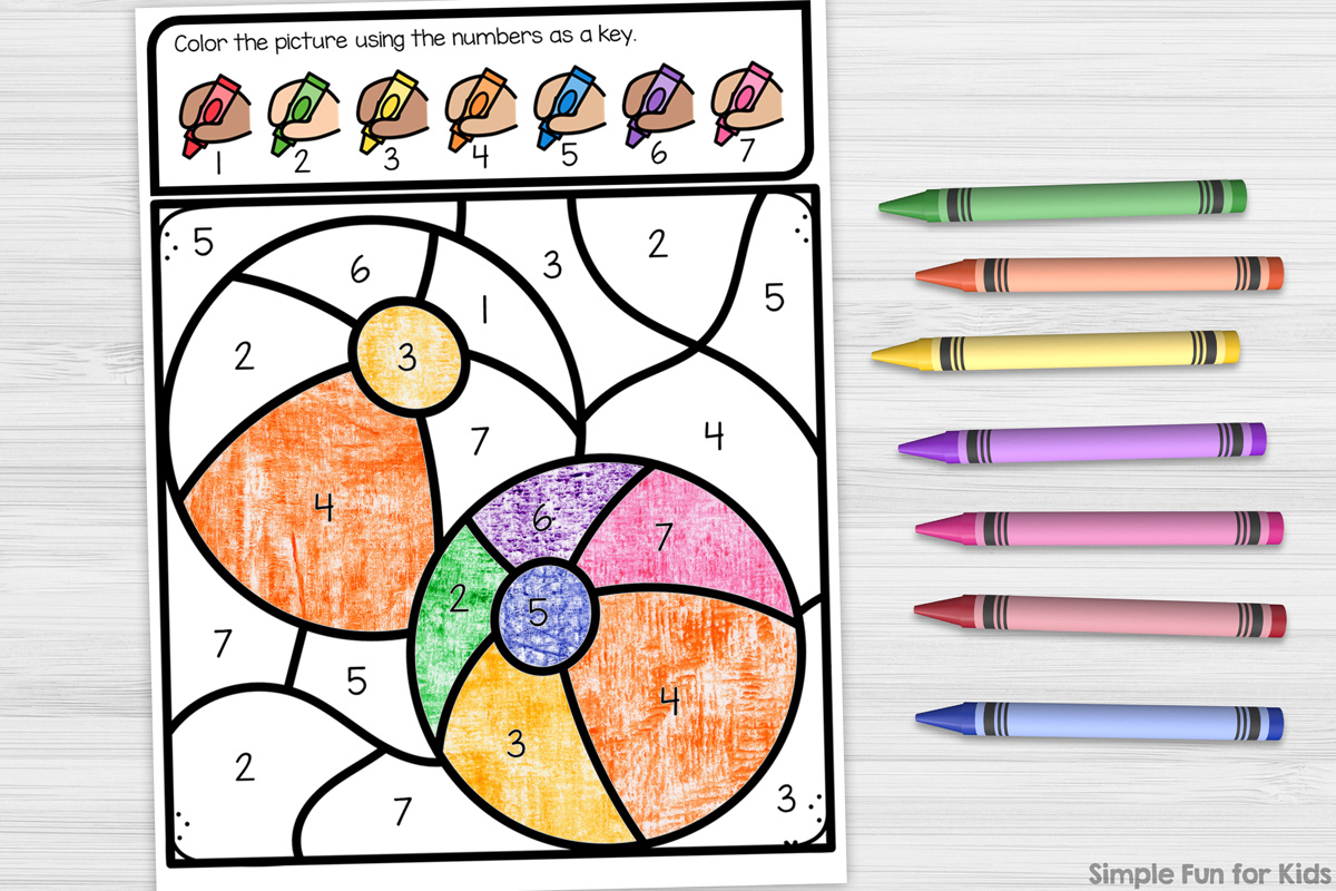 Picture of a partially colored-in coloring page showing beach balls with numbers as keys for the colors to use. Next to the sheet of paper are crayons in green, orange, yellow, purple, pink, red, and blue. A Simple Fun for Kids watermark in black is in the bottom right corner.