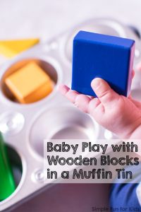 Our little friend played with this simple set up for a long time practicing fine motor skills: Baby Play with Wooden Blocks in a Muffin Tin