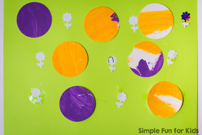 This colorful circles collage was so much fun to make! Plus, it also worked on hand strengthening and fine motor skills without even trying. It was perfect for my preschooler, but my toddler had a go, too, and didn't want to stop :)