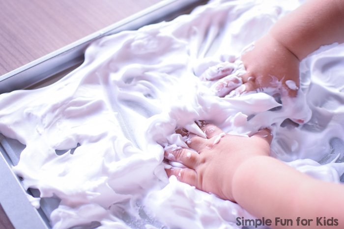 Read all about my toddler's first mark making in shaving cream experience! Simple, fun, very sensory, and great as a pre-writing activity!