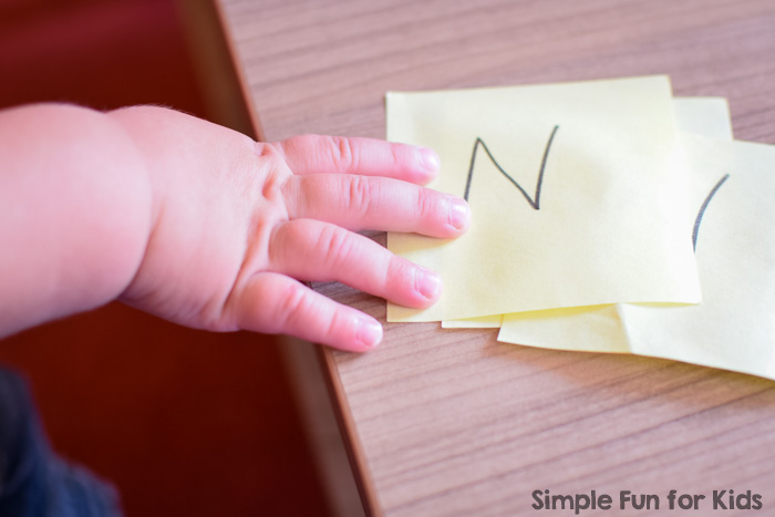 Super simple literacy activities for toddlers: My 2-year-old got all kinds of kicks from this Post-It Note Letter Hunt that helped him take another step towards learning his letters!