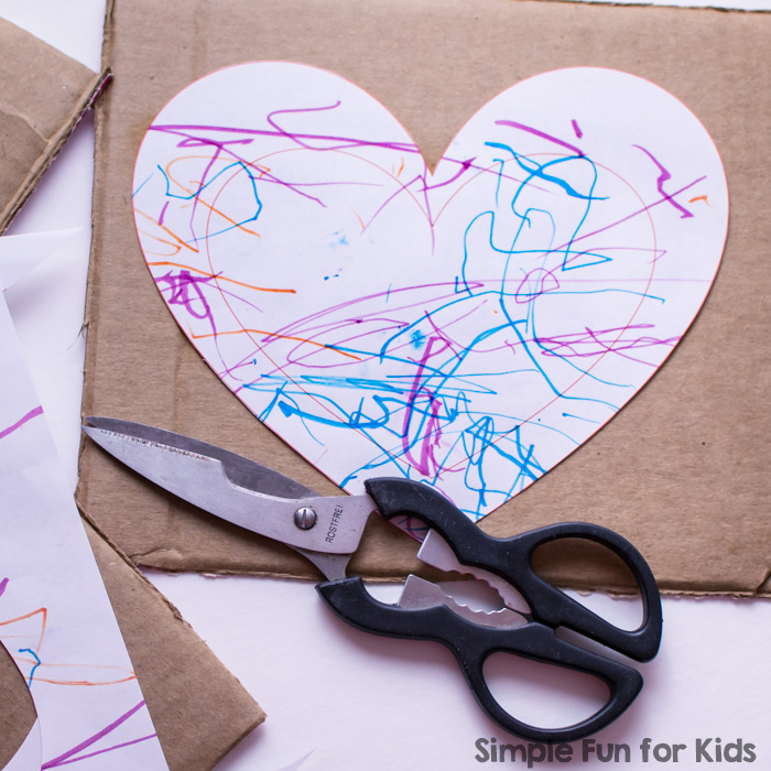 Use your toddler's art work to make this super simple heart picture frame craft! Great for Valentine's Day or just to display a favorite photo.