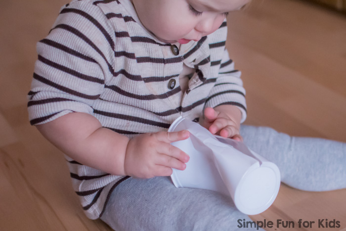 Quick and simple activity to keep your toddler busy with minimal supplies: Toddler Boredom Buster with Cups and Cotton Balls