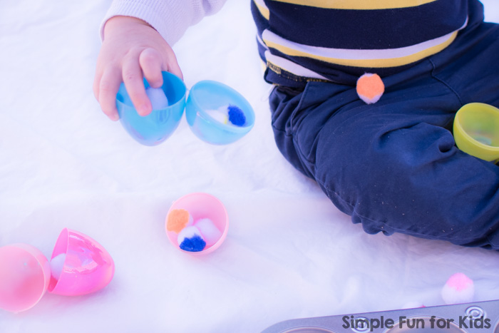 Some boredom busters never fail: This toddler play with plastic Easter eggs, pom poms, and a muffin tin used the simplest of materials, took less than a minute to put together, and kept my toddler happy and entertained!